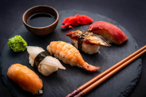 beautiful-japanese-sushi-sashimi-set-with-shrimps-ginger-soy-sauce-served-with-chopsticks-gr-2